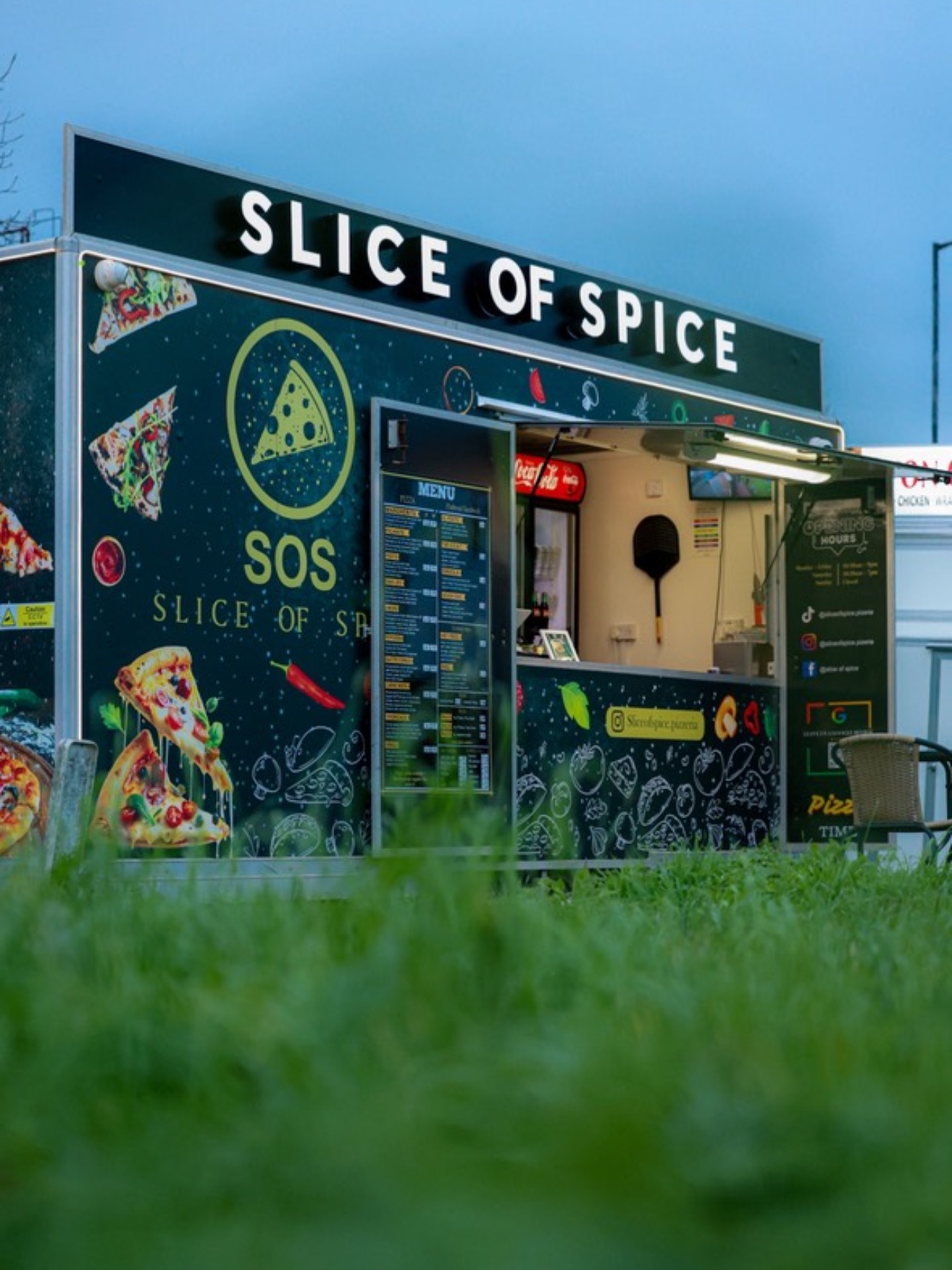 The Slice of Spice pizza trailer at dusk in Avonmouth, Bristol